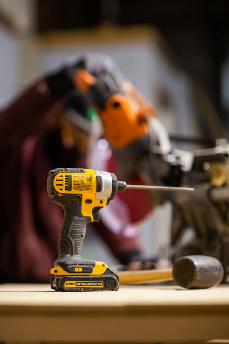 Cordless drill with lithium battery in workshop setting