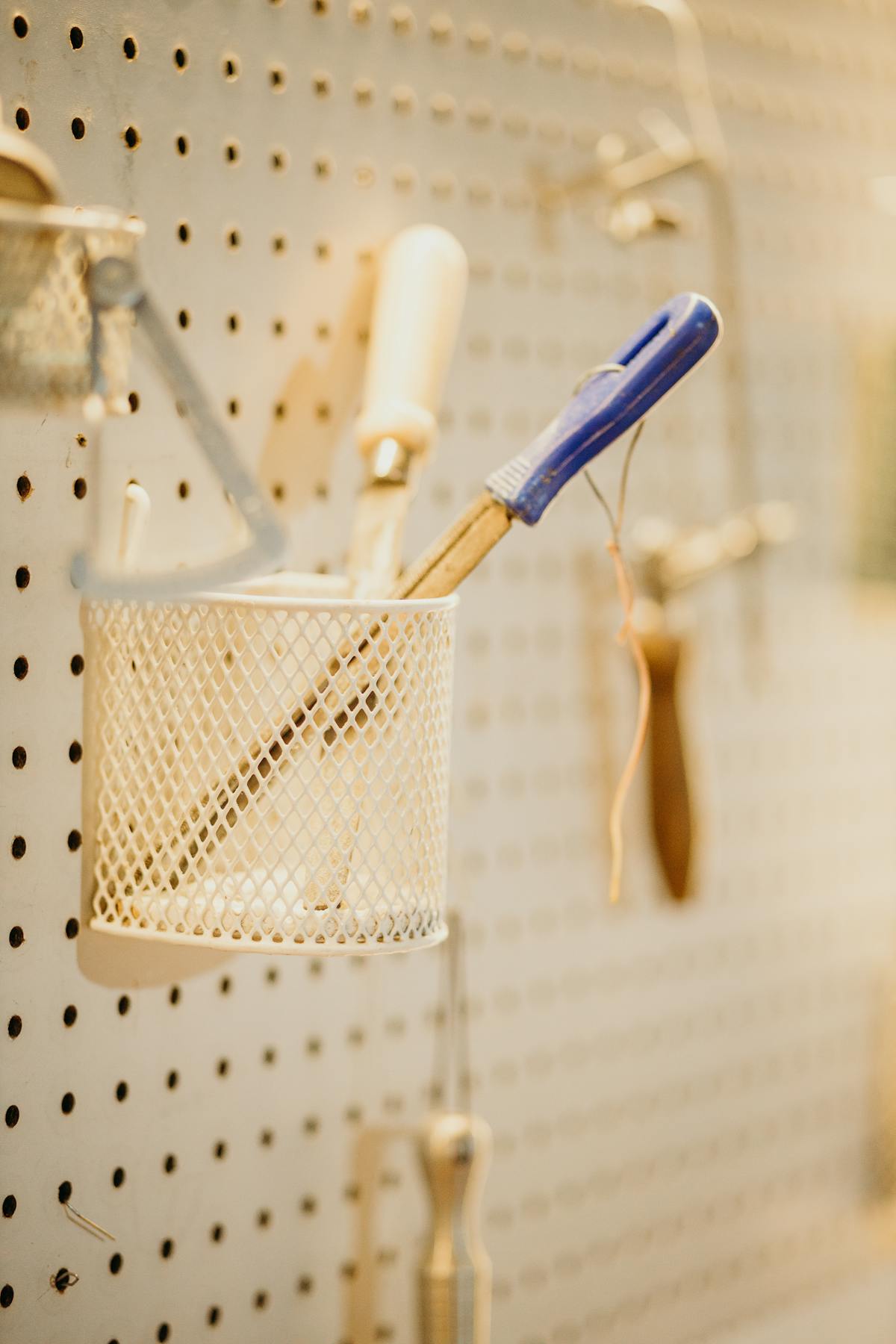 Workshop tools organized on a pegboard wall